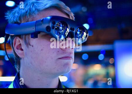 Using Magic Leap One mixed reality goggle for Mimesys debut of holographic collaboration as 2 people build drone at Intel booth at CES, Las Vegas, USA Stock Photo