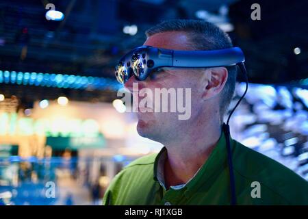 Using Magic Leap One mixed reality goggle for Mimesys debut of holographic collaboration as 2 people build drone at Intel booth at CES, Las Vegas, USA Stock Photo