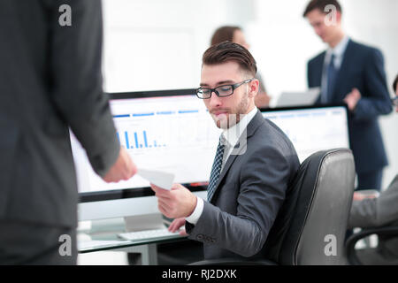 businessman working on a computer on business reports Stock Photo