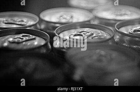 Light refreshments. Aluminum beverage cans. Drink cans. Pull tabs on cans tops. Metal containers designed for packaging of drinks and food. Carbonated Stock Photo