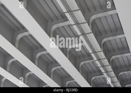 Reinforced concrete construction of the overpass bottom view of the urban landscape under the bridge Stock Photo