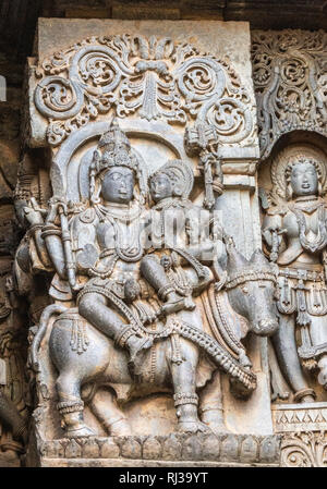 Halebidu, Karnataka, India - November 2, 2013: Hoysaleswara Temple of Shiva. Statue on side of main sanctuary, where Lord Shiva and Devi Parvati sit N Stock Photo