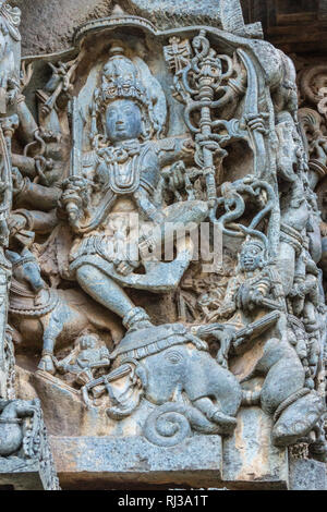 Halebidu, Karnataka, India - November 2, 2013: Hoysaleswara Temple of Shiva. Statue on side of main sanctuary, where Lord Shiva as Gajasurasamhara, ki Stock Photo