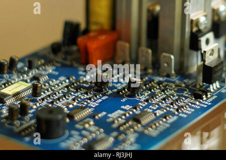 Electrons metropolis. Piece of electronic equipment - microchips, capacitors, transistors, resistances, fuses and other electronic components mounted Stock Photo
