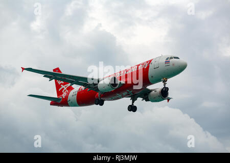 Airbus A320 AirAsia in a stormy sky Stock Photo