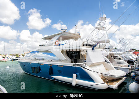 La Romana, Dominican Republic-February 16, 2016: luxury yachts docked in the port in bay at sunny day with clouds on blue sky in La romana, Dominican Republic Stock Photo