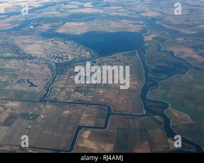 An aerial view shows the Sacramento-San Joaquin River Delta, a network of waterways, islands, and agricultural land in California, created to manage water resources and support agriculture. Stock Photo