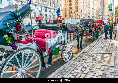 New York - October 31 2016: Horse and Carriage/ Horse and Buggy Rides parked outside Central Park in Manhattan, New York City. Stock Photo