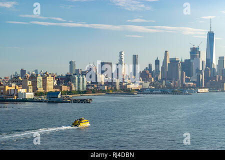 New York - October 17 2016: View of One World Trade Center standing tall in the New York City skyline from the Hudson River. Stock Photo