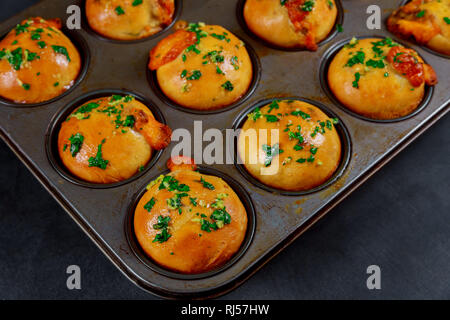 Tasty homemade little buns mushrooms and meat with garlic and herbs on a wooden background Stock Photo