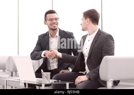 welcome handshake of business people in the Bank lobby Stock Photo