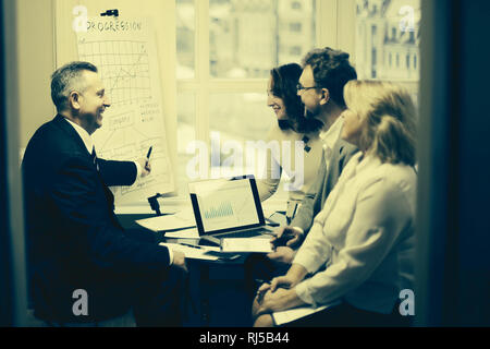 group of senior businessmen discussing a new business project. Stock Photo