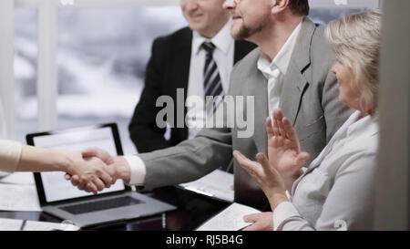 manager and client shaking hands, making good deal Stock Photo