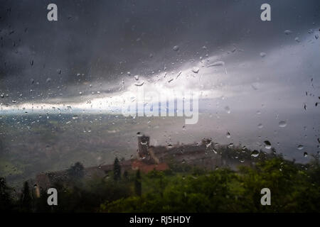View through a window with raindrops on Basilica of Santa Margherita, Basilica di Santa Margherita Stock Photo