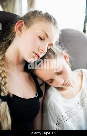 Sisters sleeping side by side Stock Photo