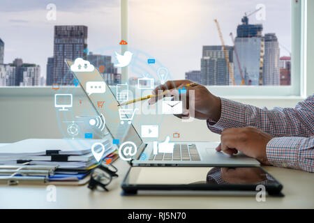Man using  tablet computer  virtual interface graphic icons network diagram Digital marketing Stock Photo