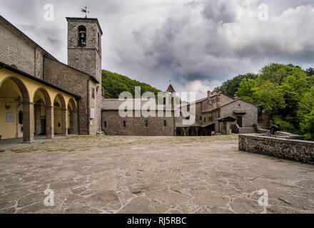 The monastery Santuario della Verna is located on a forested hill Stock Photo