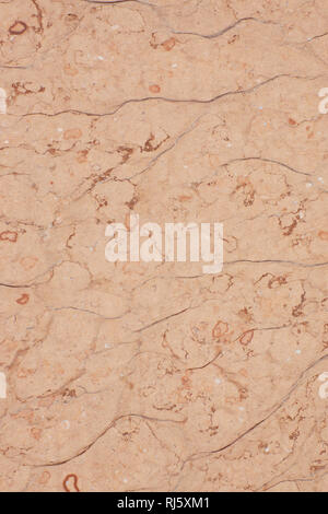 Pink stone with cracks and specks, called Perlino Rosato. Stock Photo