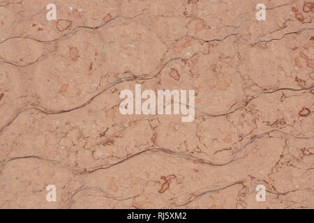 Pink stone with cracks, called Perlino Rosato. Stock Photo