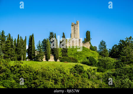 Castello di Romena located on top of a hill, framed by cypresses Stock Photo