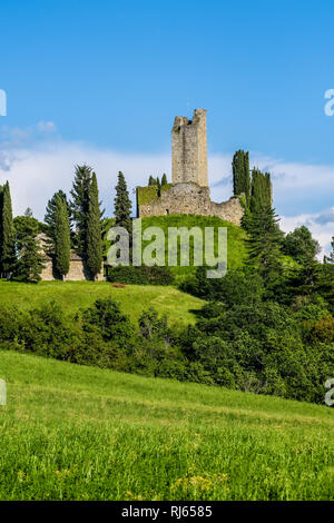 Castello di Romena located on top of a hill, framed by cypresses Stock Photo