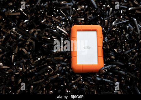 LaCie Portable storage device on a bed of magnetic tape Stock Photo