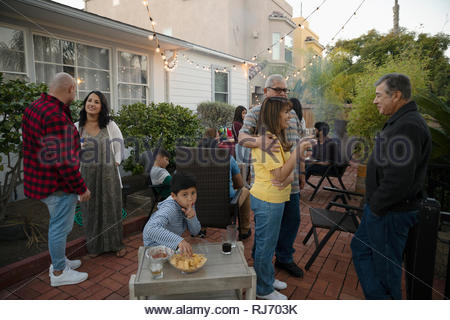 Latinx family enjoying party on patio