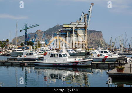 PALERMO, ITALY - JUNE 18, 2018: Ships belonging to the Italian Coast Guard moored in the harbour at Palermo, Sicily on a sunny summer morning. Stock Photo