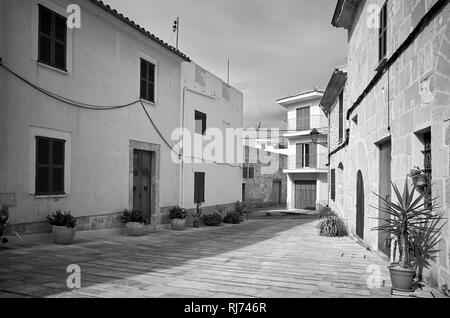 Black and white picture of an empty street in Alcudia old town, Mallorca, Spain. Stock Photo