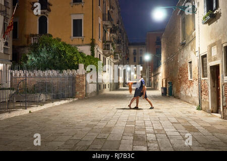 Pair dancing on streets of Venice Stock Photo