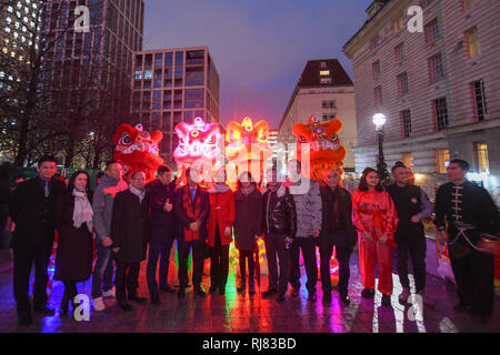 Chinese new year at the London Eye, its the year of the pig and the eye turned red and gold to celebrate the new year. LCCA Festival of Spring Celebrations in London. Stock Photo