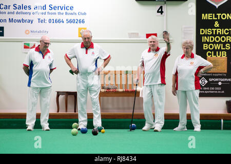 Melton Mowbray Indoor Bowls Club, Leicestershire, UK. 4th February 2019, Charity bowls match between Bowls England,  National Governing Body  for the sport of Flat Green Lawn Bowls in England and the EIBA, English Indoor Bowls Association. The match was finally won by the EIBA. Credit: Jim Harrison/Alamy Live News Stock Photo