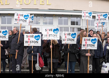 Weston-super-Mare, UK. 5th February, 2019. Demonstrators protest against the proposed downgrading of services at Weston General Hospital. The demonstration took place outside the Royal Hotel where the Governing Body of the Bristol, North Somerset and South Gloucestershire Clinical Commissioning Group was meeting to consider the proposals. Keith Ramsey/Alamy Live News Stock Photo