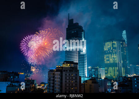 Celebration. Skyline with fireworks light up sky over business district in Ho Chi Minh City ( Saigon ), Vietnam. Beautiful night view cityscape. Holid