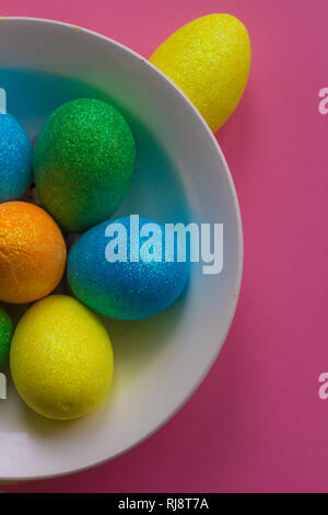 Easter card. Painted eggs in a basket and flowers in a vase. Orthodox holiday. Religion and culture Stock Photo