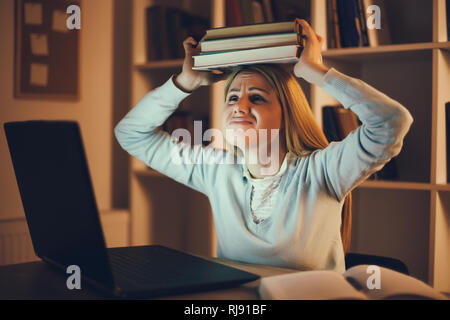 Student has too much to learn at home. Stock Photo