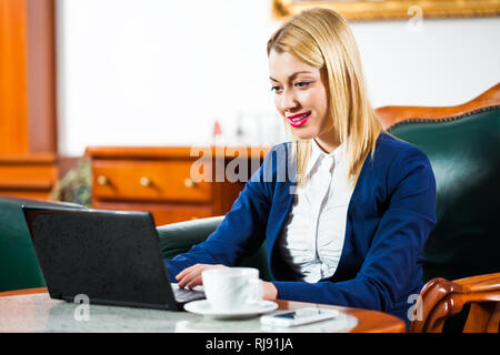 Businesswoman in office Stock Photo