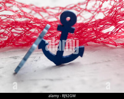 Background with decorative anchors and wheels on a white painted background. Place for text. Top view with copy space Stock Photo