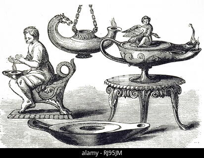 An engraving depicting decorative Roman oil lamps. Dated 19th century Stock Photo