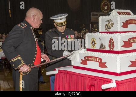 U.S. Marine Corps Maj. Gen. Walter L. Miller, Jr., commanding general of II Marine Expeditionary Force (II MEF), left, cuts a cake at the II MEF Marine Corps Birthday Ball at Marine Corps Base Camp Lejeune, N.C., Nov. 5, 2016. Commandant of the Marine Corps Gen. Robert B. Neller attended the birthday ball as the guest of honor.