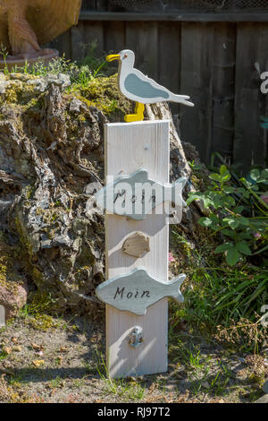Seagulls on a sign saying MOIN (good day / North German) Stock Photo