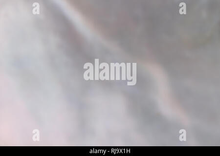 Abstract pearl background with shimmering nacreous mother of pearl grey and pink colours Stock Photo