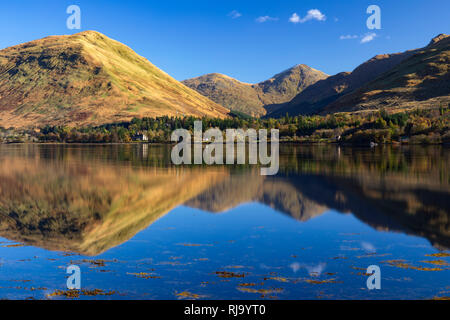 The Arrochar Alps in the Loch Lomond and Trossachs National Park reflected in Loch Fyne. Stock Photo
