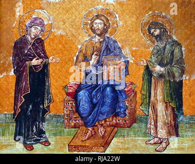 Virgin Mary; Jesus Christ and John the Baptist, depicted on an 13th Century, Byzantine mosaic; Hagia Sofia, Istanbul, Turkey. Hagia Sophia is a former Greek Orthodox, Christian church, later an Ottoman imperial mosque and now a museum. Built in 537 AD at the beginning of the Middle Ages, it was famous in particular for its massive dome. It was the world's largest building and an engineering marvel of its time. Stock Photo