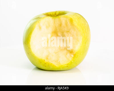 front view of bitten yellow apple fruit on plate on white background Stock Photo