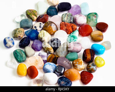 above view of many various gemstones on white board Stock Photo