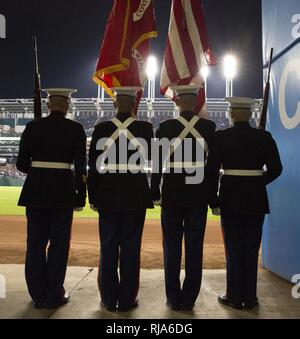 CLEVELAND – Marines from Headquarters Company, 3rd Battalion, 25th Marine Regiment, 4th Marine Division, stand ready to take the field and present the national colors at game one of the 2016 World Series at Progressive Field in Cleveland, Oct. 25, 2016. Just before the ceremony, announcer Bob Tyek gave credit to the Marine Corps Reserve and its 100 years of faithful service. Today, approximately 500 Reserve Marines are providing fully integrate global operational support to the Fleet and Combatant Commanders. Stock Photo