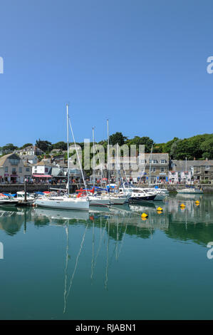 Sailing boats floating on the water during high tide on a summers day in Padstow Harbour, Cornwall, England. Stock Photo