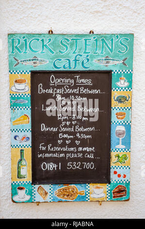 Rick Stein's Cafe Padstow, Cornwall. A chalkboard displaying the opening times outside the business premises. Stock Photo