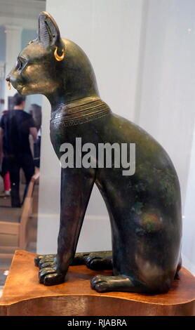 The Gayer-Anderson Cat is an Ancient Egyptian statue of a cat, which dates from the Late Period (around 664–332 BC). It is made of bronze, with gold ornaments. The sculpture is known as the Gayer-Anderson cat after Major Robert Grenville Gayer-Anderson. The cat wears jewellery and a protective wadjet amulet. A scarab appears on the head and a winged scarab is shown on the chest. Stock Photo